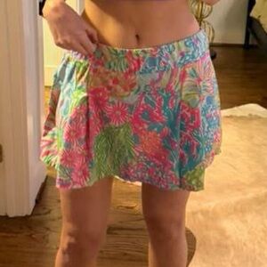 Lilly Pulizter tennis/golf skirt with pink shorts & pockets underneath